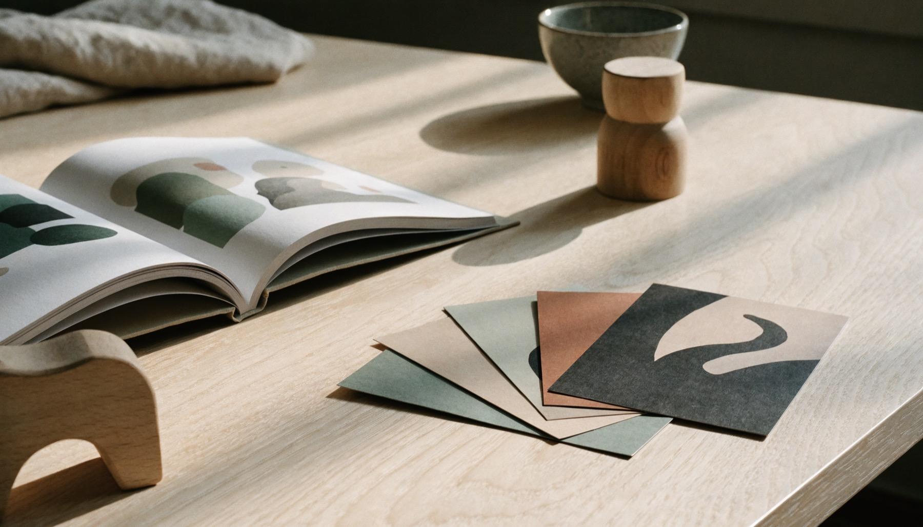 A fan of Zolu content cards beside an open picture book